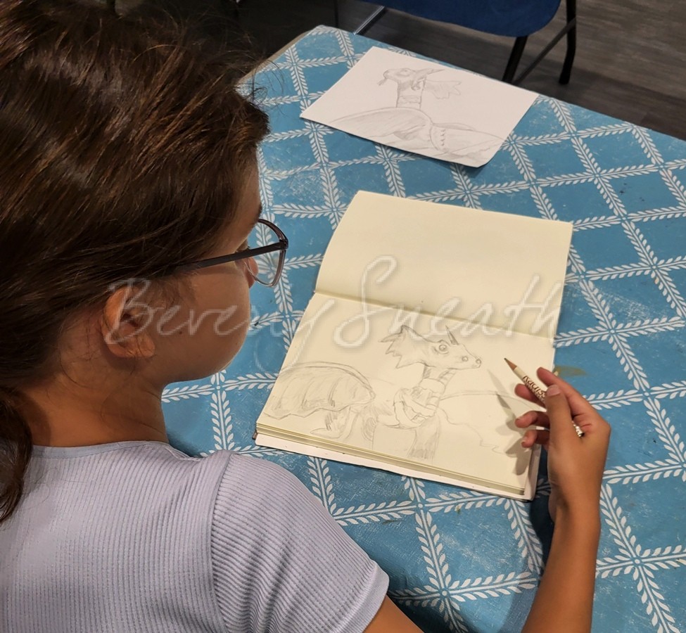 girl drawing a dragon